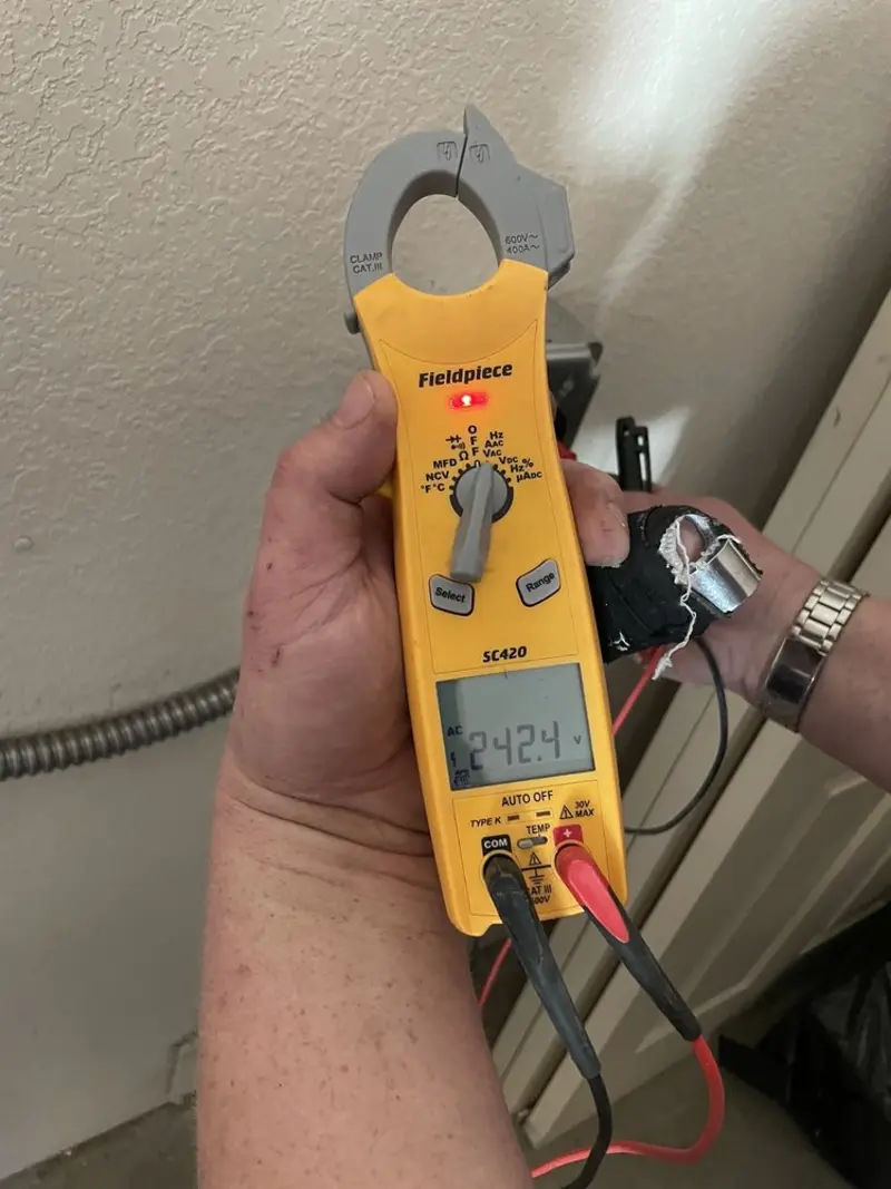 Voltage testing with clamp meter during Ceiling Fan Installation in Salisbury